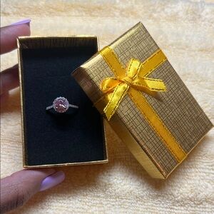 925 Sterling silver band with 1ct pink moissanite diamond around it is CZ size 7